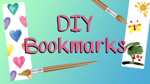 Image reads "DIY Bookmarks" against a green to blue gradient background. A bookmark with hearts is to the left of the title and a bookmark with an outdoor scene is to the right of the title. There are 2 paint brushes pointed at the bookmarks.