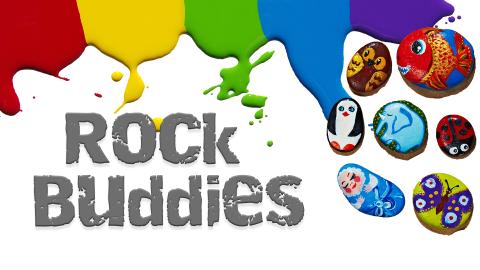 Image reads "Rock Buddies" against a white background. Paint is dripping from the top of the image. Painted rocks are to the right of the title.