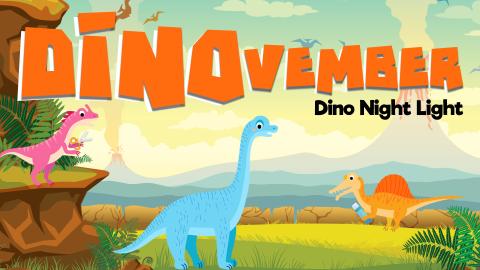 Image reads "DINOvember: Dino Night Light" against a prehistoric dinosaur scene. A dinosaur holding scissors is under the title to the left and an orange dinosaur holding a glue stick is under the title to the right.