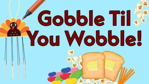 Image reads "Gobble Til You Wobble!" against a blue background. A turkey windchime and a marker are to the left of the title. Under the title is an untraditional Thanksgiving feast of two pieces of toast, popcorn, pretzel sticks, and jellybeans.