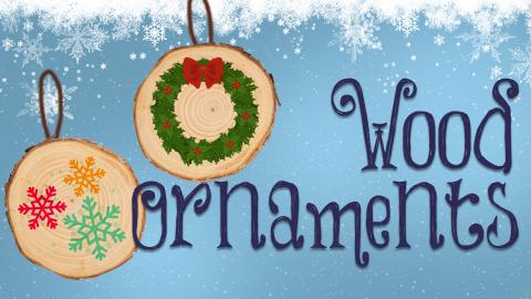 Image reads "Wood Ornaments" against a snowy background. Two wooden ornaments are to the left of the title. One ornament has snowflakes on it and one ornament has a wreath on it.