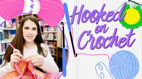 Image reads "Hooked on Crochet" against a knit background. To the left of the title is a picture of the presenter, Katelyn Ford and above her picture is a bundle of pink yarn. To the right of the title is a crochet flower and under the title is a ball of blue yarn. There are crochet hooks and threads of yarn among the image.