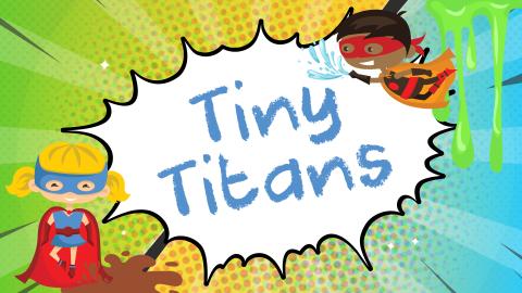 Image reads "Tiny Titans" against a comic book background. Two children dressed as superheroes are on either side of the title and mad, water, and slime are scattered among the image.