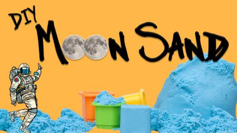 Image reads "DIY Moon Sand" against an orange background. Blue moon sand is under the title with some sand toys for playing and an astronaut.
