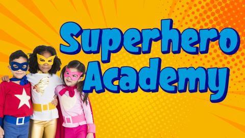 Image reads "Superhero Academy" against a comic background. Three children in superhero costumes are to the bottom left of the title.