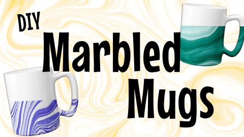 Image reads "DIY Marbled Mugs" against a light orange marbled background. To the right and left of the title are two marbled coffee mugs.