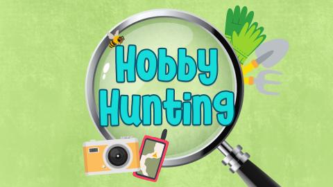 Image reads "Hobby Hunting" against a green textured background. Behind the text is a magnifying glass and items to represent hobbies surrounding it. There is a camera, a geocaching device, a bee, gardening tools, and gardening gloves. 