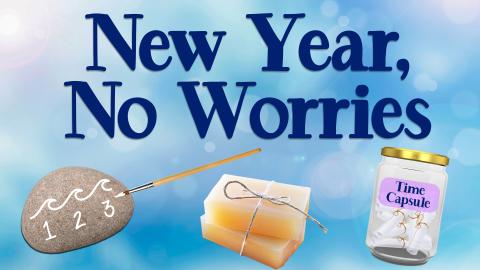 Image reads "New Year, No Worries" against a blue background. Under the title are 3 crafts, one is a painted calming stone with a paintbrush, one is a lotion bar, and one is a time capsule with paper scrolls inside. 