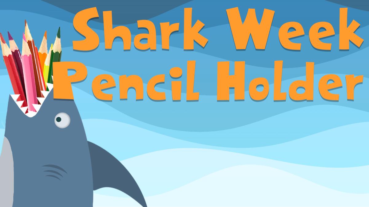 Image reads "Shark Week Pencil Holder" against a blue wavy background. A shark pencil holder with colored pencils is to the left of the title.