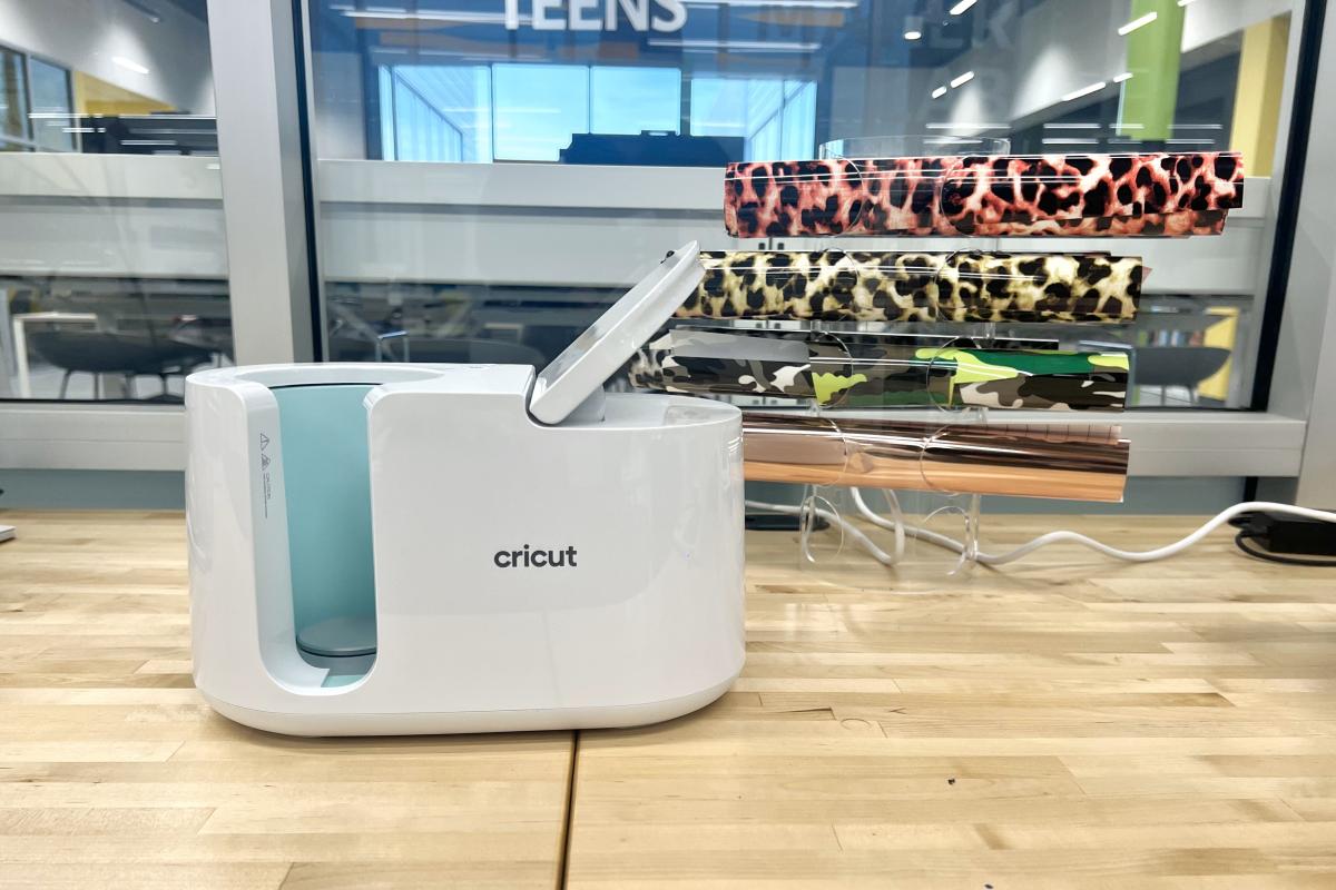 Image shows a Cricut mug heat press. 