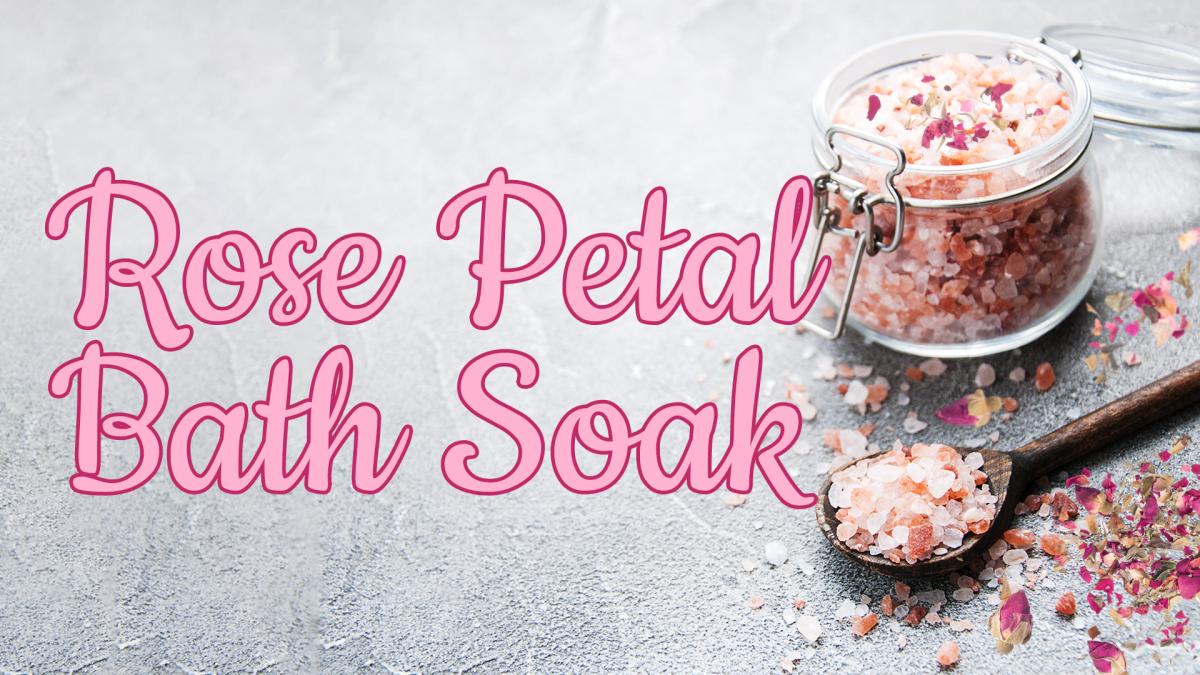 Image reads "Rose Petal Bath Soak" against a grey textured background. To the right of the title is a jar full of bath salts and rose petals.