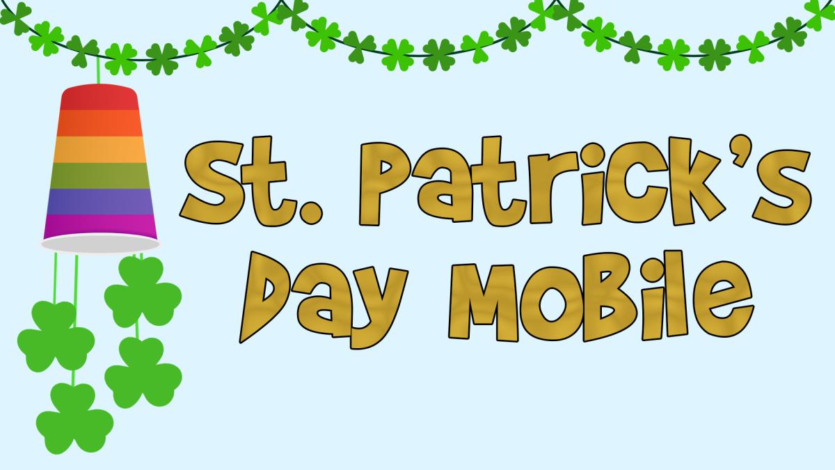 Image reads "St. Patrick's Day Mobile" against a blue background. A mobile made of a rainbow cup and three leaf clovers is to the left of the title.